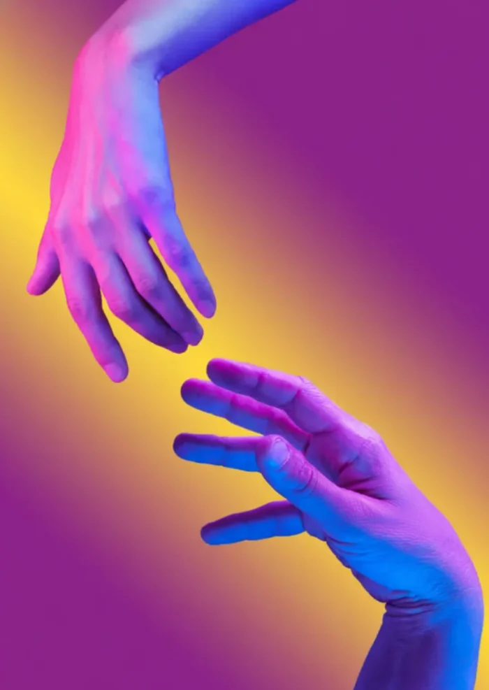 An image of two hands pointing at each other, symbolizing connection and new beginnings, the foundation of Eravue.